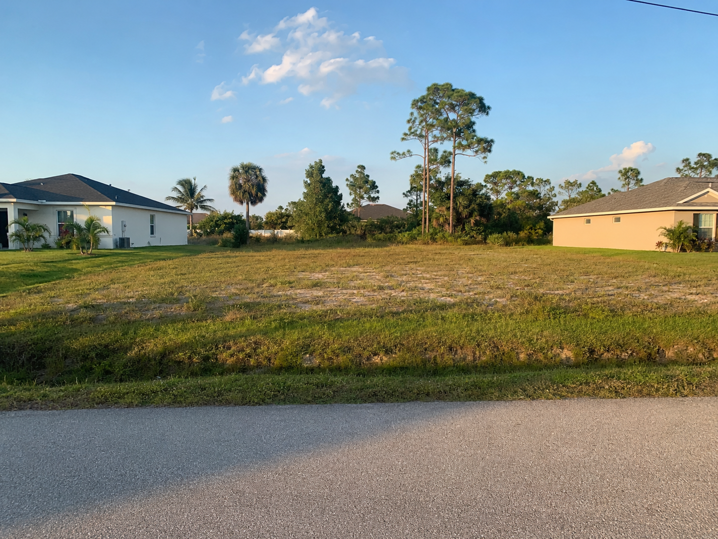 Representative vacant infill lot between homes in Lehigh Acres, Florida